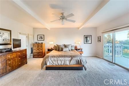 21651 Yucatan Ave, Woodland Hills, CA 91364 - bedroom featuring access to exterior, beam ceiling, light colored carpet, and ceiling fan