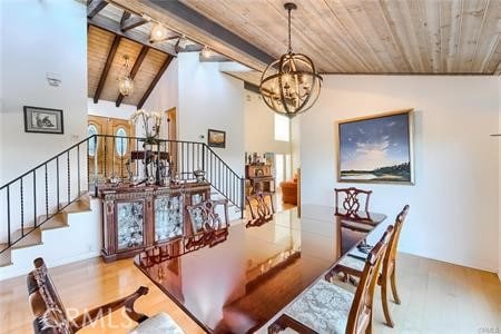 21651 Yucatan Ave, Woodland Hills, CA 91364 - dining space with wooden ceiling, a chandelier, wood finished floors, and stairs