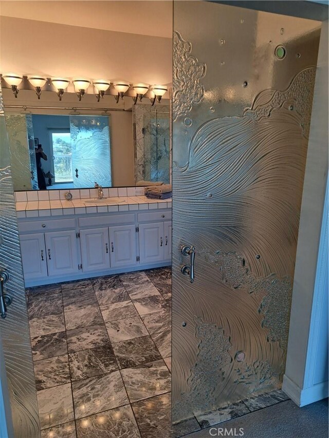 21651 Yucatan Ave, Woodland Hills, CA 91364 - bathroom featuring double vanity