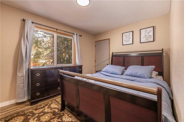 196 Sunset Ln, Sugarloaf, CA 92386 - bedroom with wood finished floors and baseboards
