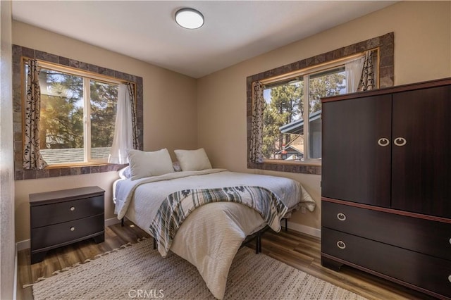 196 Sunset Ln, Sugarloaf, CA 92386 - bedroom with baseboards and wood finished floors
