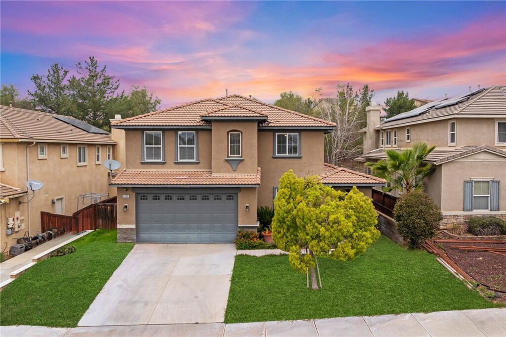 37892 High Ridge Dr, Beaumont, CA 92223 - mediterranean / spanish-style home featuring concrete driveway, fence, an attached garage, a tiled roof, and a front yard