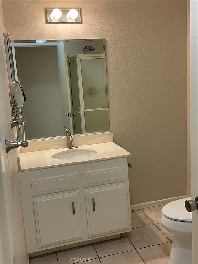 2370 Via Mariposa W Unit 1B, Laguna Woods, CA 92637 - bathroom featuring tile patterned floors, vanity, a shower stall, and a textured wall