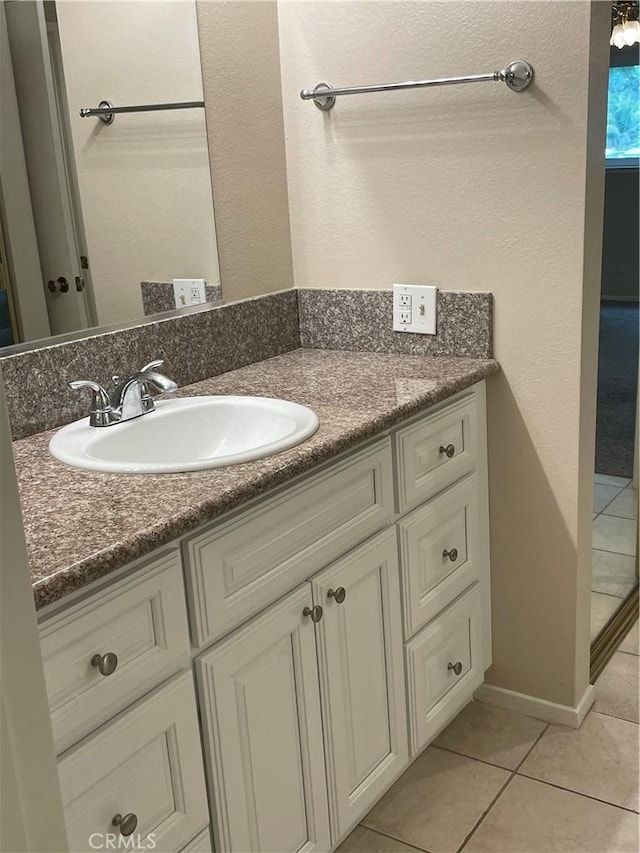 bathroom featuring vanity and tile patterned flooring