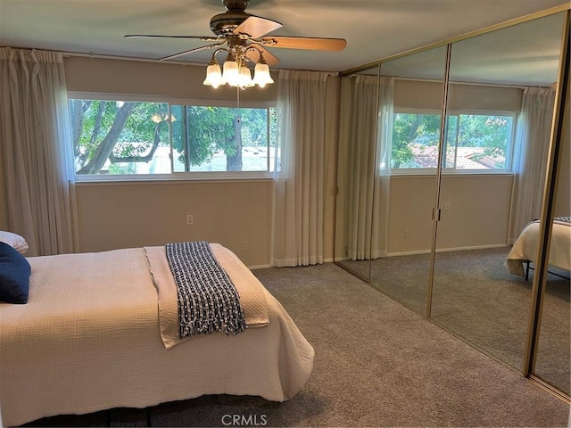 2370 Via Mariposa W Unit 1B, Laguna Woods, CA 92637 - bedroom featuring multiple windows, carpet floors, a closet, and ceiling fan