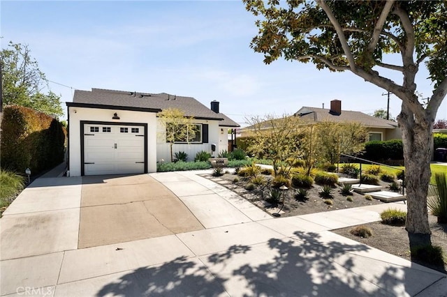 single story home with stucco siding, driveway, and an attached garage
