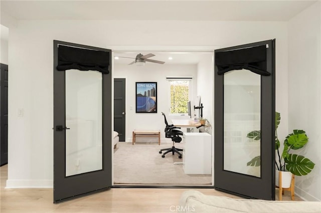 office area featuring ceiling fan, baseboards, and light wood-style floors