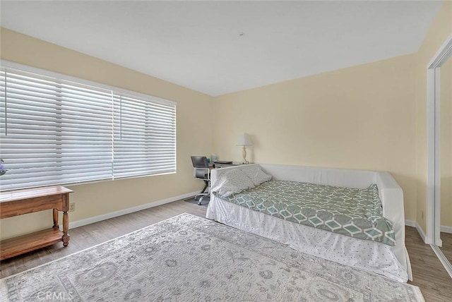 4018 W 5th St Unit J, Santa Ana, CA 92703 - bedroom with baseboards and wood finished floors