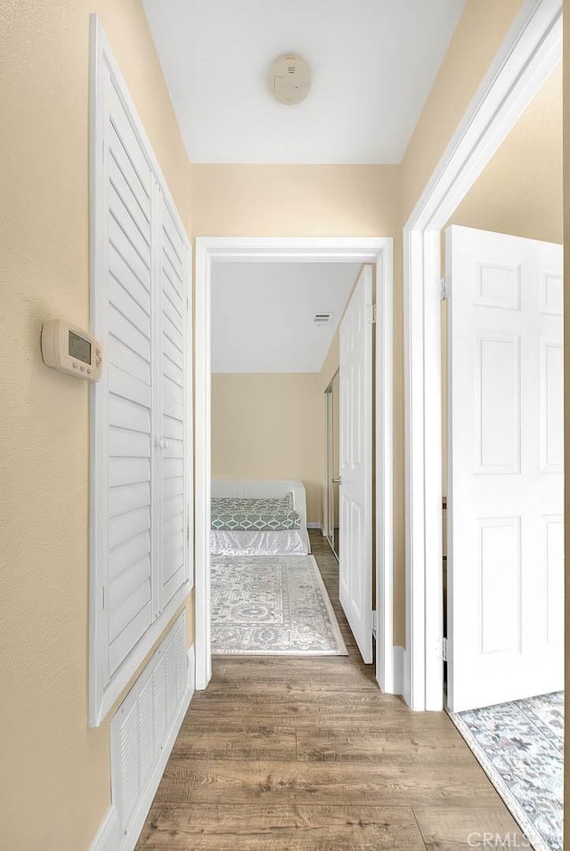 4018 W 5th St Unit J, Santa Ana, CA 92703 - hallway featuring wood finished floors and visible vents