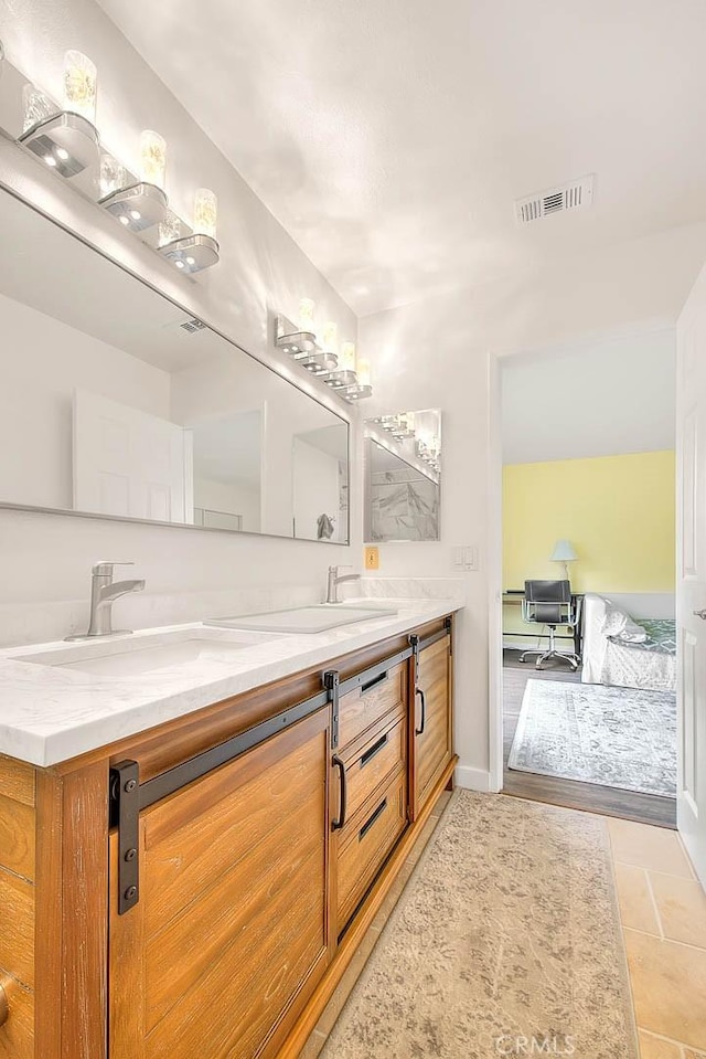 4018 W 5th St Unit J, Santa Ana, CA 92703 - full bath featuring baseboards, visible vents, a sink, and double vanity
