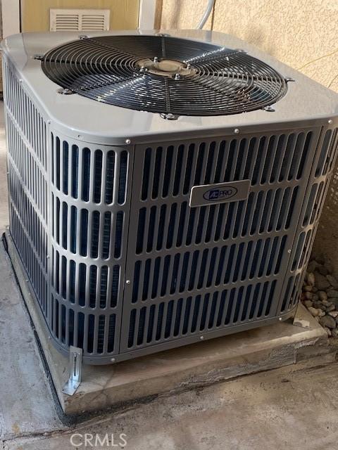 4018 W 5th St Unit J, Santa Ana, CA 92703 - details with central air condition unit, a gate, and visible vents