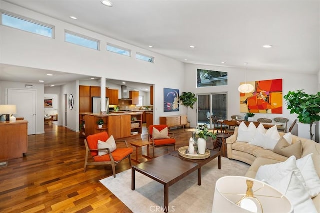 2377 Silver Ridge Ave, Los Angeles, CA 90039 - living room featuring wood finished floors, a towering ceiling, plenty of natural light, and recessed lighting