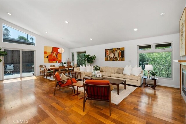 2377 Silver Ridge Ave, Los Angeles, CA 90039 - living area with vaulted ceiling, wood finished floors, recessed lighting, and a glass covered fireplace