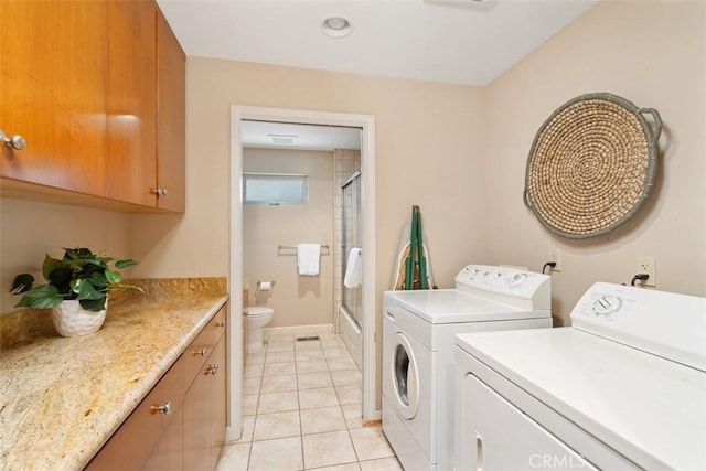 2377 Silver Ridge Ave, Los Angeles, CA 90039 - laundry area with separate washer and dryer, cabinet space, and light tile patterned floors