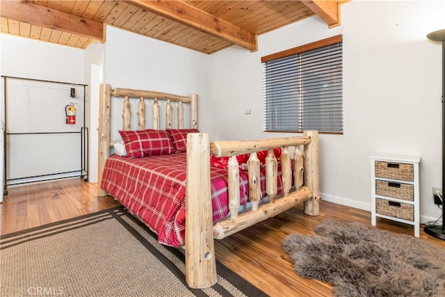 212 Vista Ln, Sugarloaf, CA 92386 - bedroom with baseboards, wood finished floors, wooden ceiling, and beam ceiling