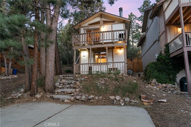 212 Vista Ln, Sugarloaf, CA 92386 - view of front of home with a balcony and covered porch