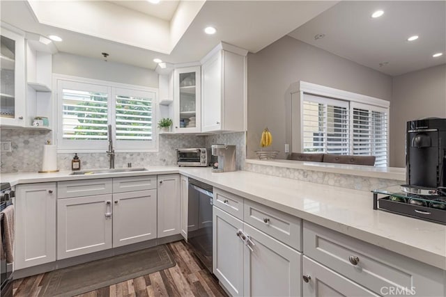 14919 Dickens St Unit 104, Sherman Oaks, CA 91403 - kitchen with stainless steel dishwasher, dark wood finished floors, white cabinetry, recessed lighting, and backsplash