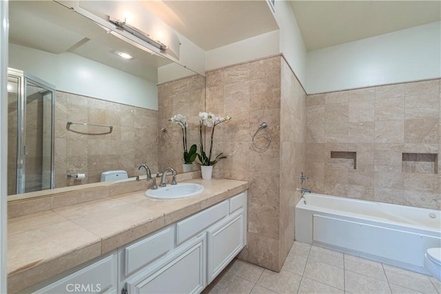 14919 Dickens St Unit 104, Sherman Oaks, CA 91403 - bathroom with tile walls, vanity, tile patterned flooring, a bathtub, and a shower