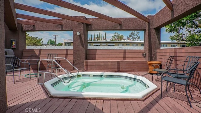 wooden deck with fence and hot tub deck surround