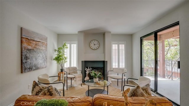 living room with wood finished floors and a fireplace
