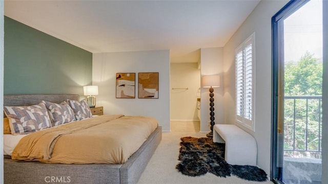 carpeted bedroom with baseboards