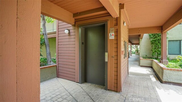 entrance to property featuring elevator