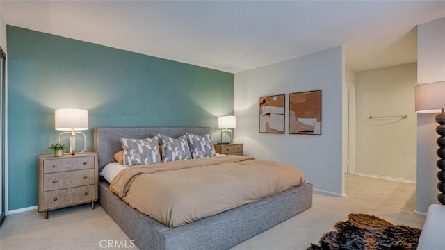 bedroom featuring carpet floors and baseboards