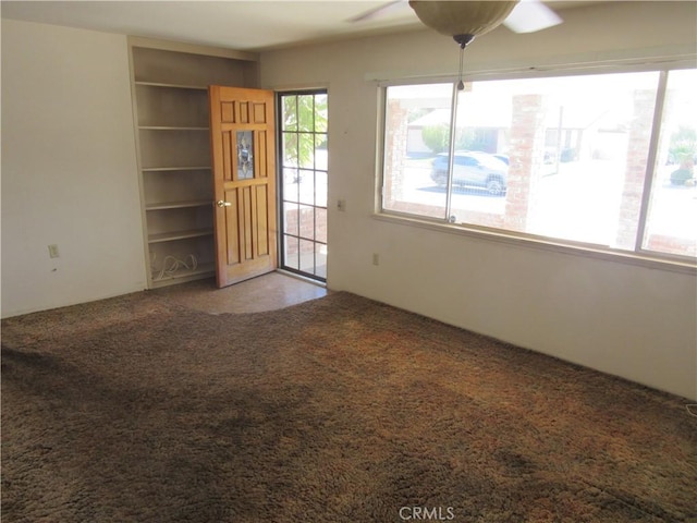 interior space featuring a ceiling fan