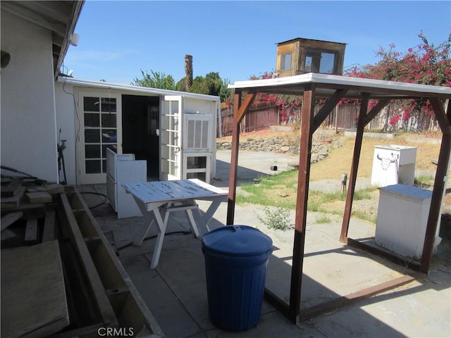 view of patio / terrace featuring fence