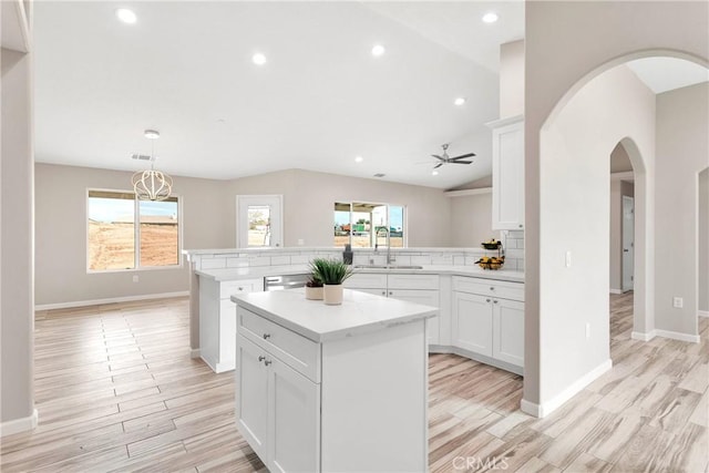 18420 Wisteria St, Hesperia, CA 92345 - kitchen featuring a healthy amount of sunlight, a ceiling fan, a sink, and a peninsula