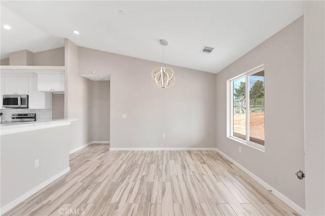 18420 Wisteria St, Hesperia, CA 92345 - interior space featuring light wood finished floors, baseboards, visible vents, and lofted ceiling
