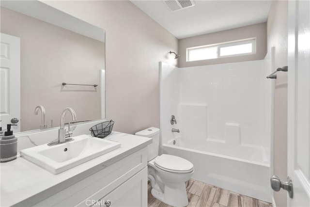 18420 Wisteria St, Hesperia, CA 92345 - bathroom featuring toilet, bathing tub / shower combination, vanity, wood finished floors, and visible vents