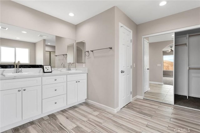 18420 Wisteria St, Hesperia, CA 92345 - bathroom featuring baseboards, a sink, recessed lighting, and wood finished floors