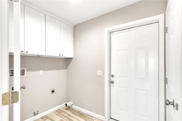 18420 Wisteria St, Hesperia, CA 92345 - laundry room featuring baseboards, cabinet space, light wood-style floors, and electric dryer hookup