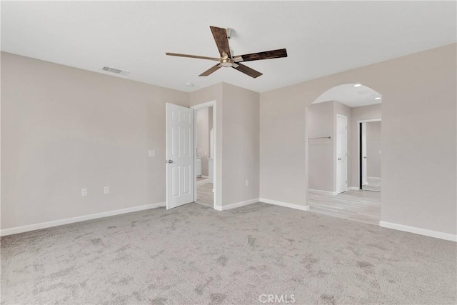 18420 Wisteria St, Hesperia, CA 92345 - carpeted spare room featuring baseboards, visible vents, arched walkways, and a ceiling fan