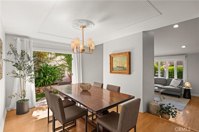 3332 Alabama Cir, Costa Mesa, CA 92626 - dining space with a chandelier, light wood-style floors, a tray ceiling, recessed lighting, and baseboards