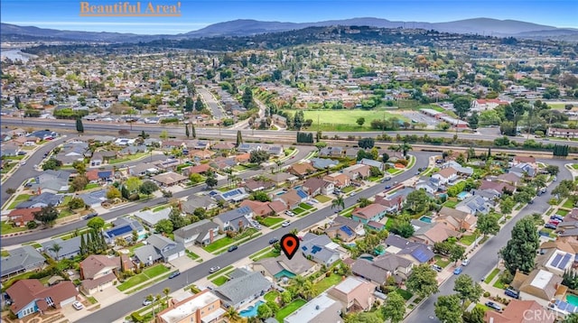 drone / aerial view with a mountain view and a residential view