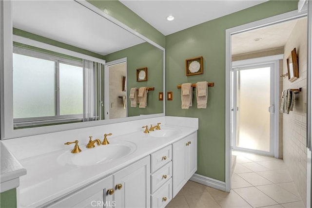 3118 N Hartman St, Orange, CA 92865 - bathroom featuring baseboards, tile patterned flooring, double vanity, and a sink