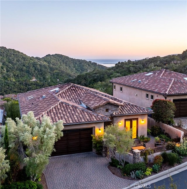 2865 Rock Wren Ln, Avila Beach, CA 93424 - mediterranean / spanish-style home featuring a tile roof, a garage, fence, french doors, and driveway