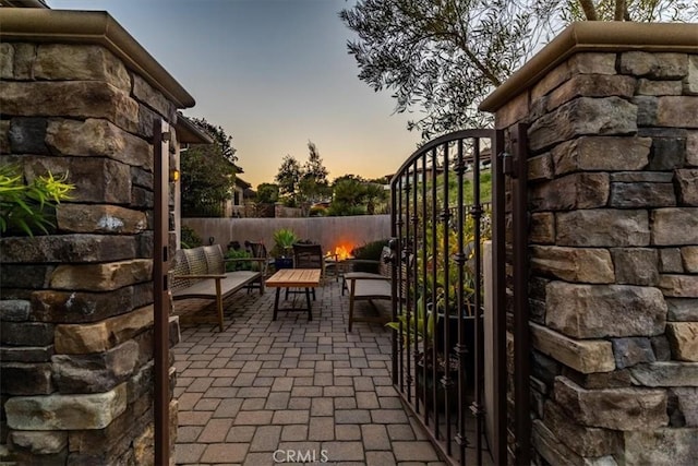 2865 Rock Wren Ln, Avila Beach, CA 93424 - patio terrace at dusk with a gate and an outdoor living space