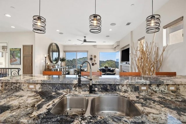 2865 Rock Wren Ln, Avila Beach, CA 93424 - kitchen with a ceiling fan, stone counters, recessed lighting, and hanging light fixtures