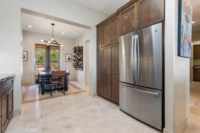 2865 Rock Wren Ln, Avila Beach, CA 93424 - kitchen with freestanding refrigerator, dark brown cabinets, recessed lighting, hanging light fixtures, and baseboards