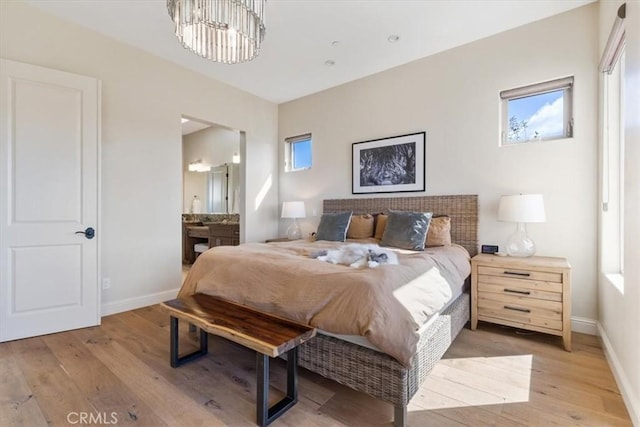 2865 Rock Wren Ln, Avila Beach, CA 93424 - bedroom with light wood-style floors, baseboards, and multiple windows