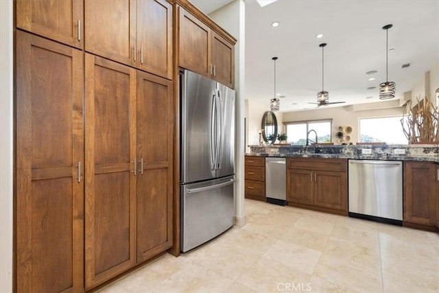 2865 Rock Wren Ln, Avila Beach, CA 93424 - kitchen with appliances with stainless steel finishes, a sink, dark stone counters, pendant lighting, and recessed lighting