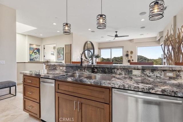 2865 Rock Wren Ln, Avila Beach, CA 93424 - kitchen featuring stainless steel dishwasher, brown cabinetry, decorative light fixtures, dark stone countertops, and recessed lighting