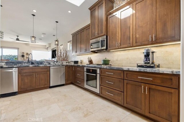 2865 Rock Wren Ln, Avila Beach, CA 93424 - kitchen featuring stainless steel appliances, a sink, tasteful backsplash, dark stone countertops, and recessed lighting