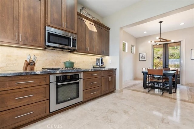 2865 Rock Wren Ln, Avila Beach, CA 93424 - kitchen with stainless steel appliances, backsplash, french doors, dark stone countertops, and hanging light fixtures