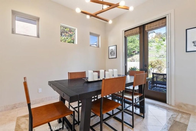 2865 Rock Wren Ln, Avila Beach, CA 93424 - dining room featuring french doors, light tile patterned floors, and baseboards