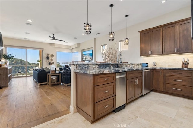 2865 Rock Wren Ln, Avila Beach, CA 93424 - kitchen featuring a ceiling fan, a peninsula, dark stone countertops, open floor plan, and stainless steel dishwasher
