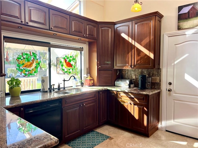 kitchen featuring light stone counters, light tile patterned floors, decorative backsplash, a sink, and black dishwasher